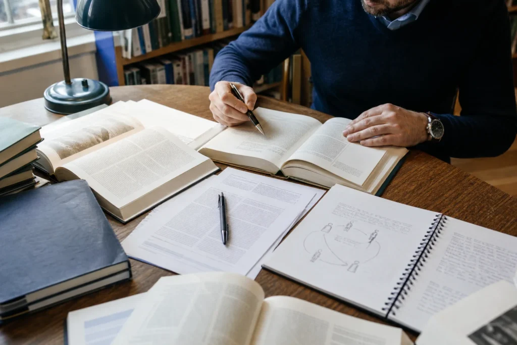 Clinician-researcher reviewing psychosexual therapy evidence and theory